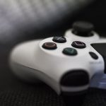 Close-up of a gaming controller on a textured surface