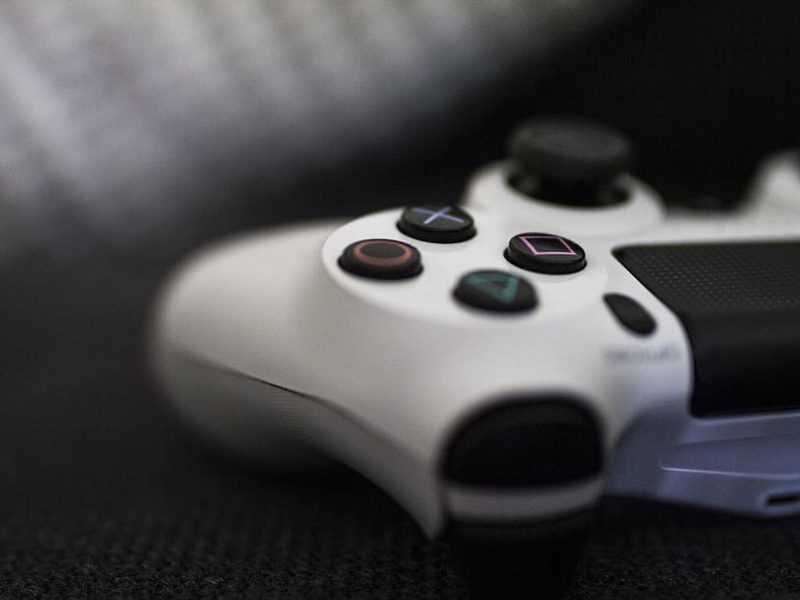 Close-up of a gaming controller on a textured surface