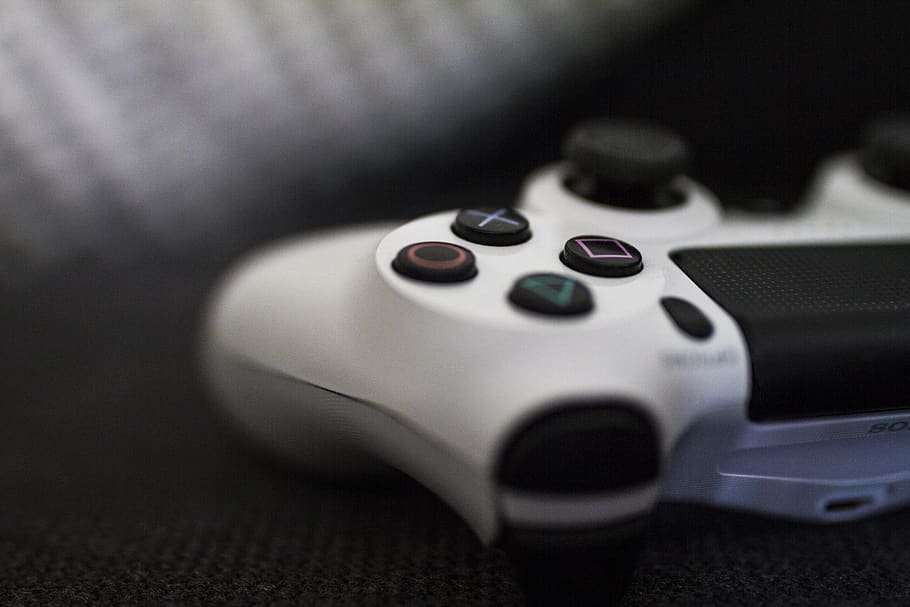 Close-up of a gaming controller on a textured surface