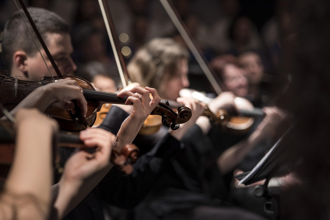 Violins, musicians, orchestra — Experience Real Casino Energy When You Start Playing Baccarat